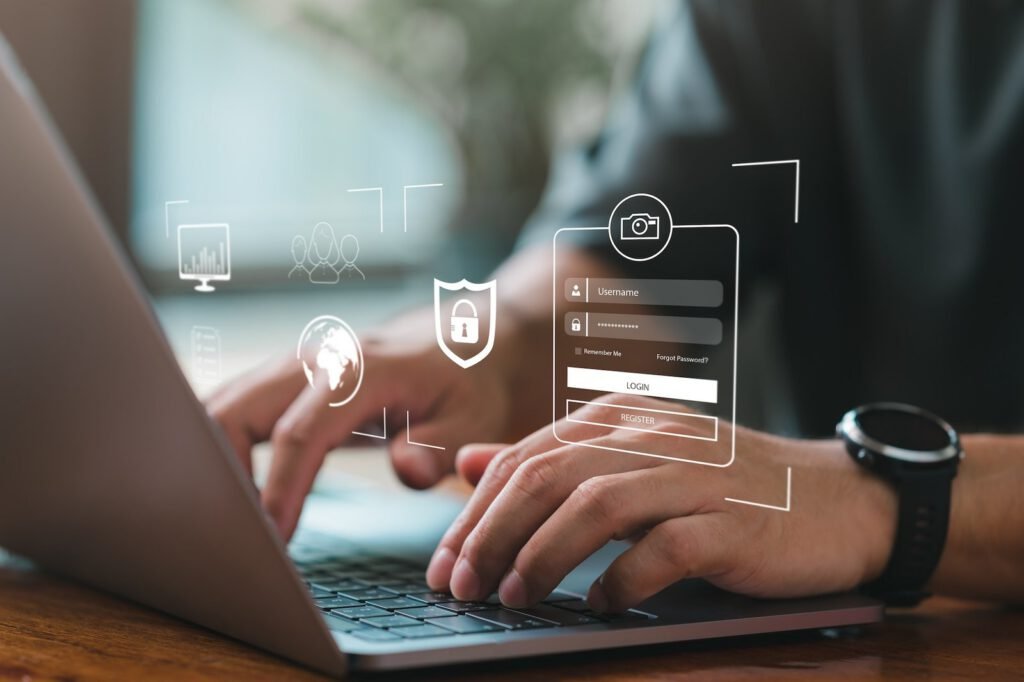 Person typing on a laptop with digital login and security icons overlaid, representing cybersecurity or secure online access for health and wellness platforms.