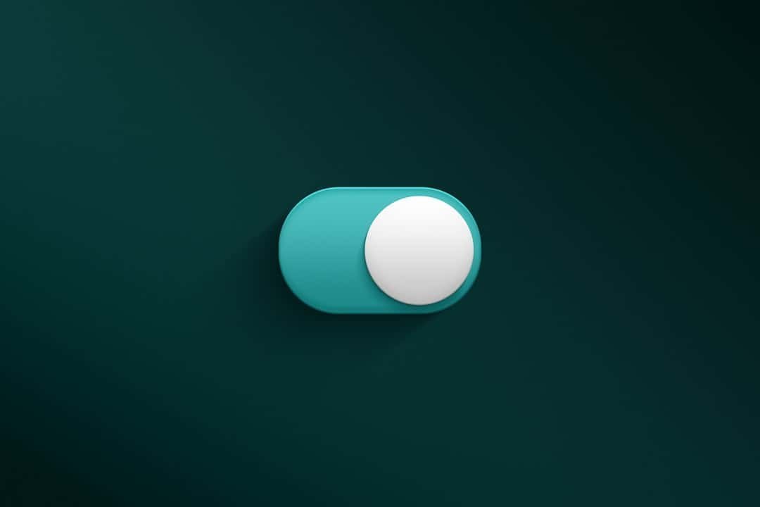 A teal toggle switch with a white circular slider is shown in the "off" position against a dark green background, making it ideal as a subtle CTA element.