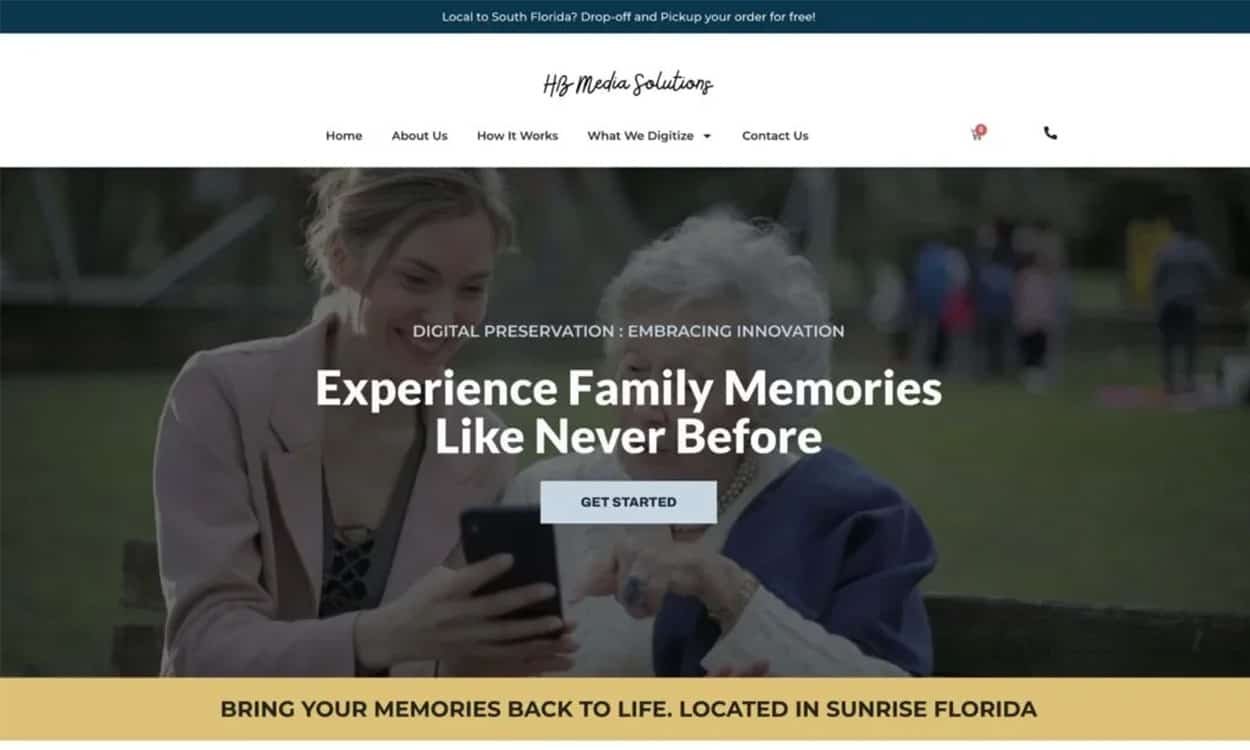 Two women, one younger and one older, look at a smartphone together on a website with thoughtful website design, promoting digital preservation services for family memories.