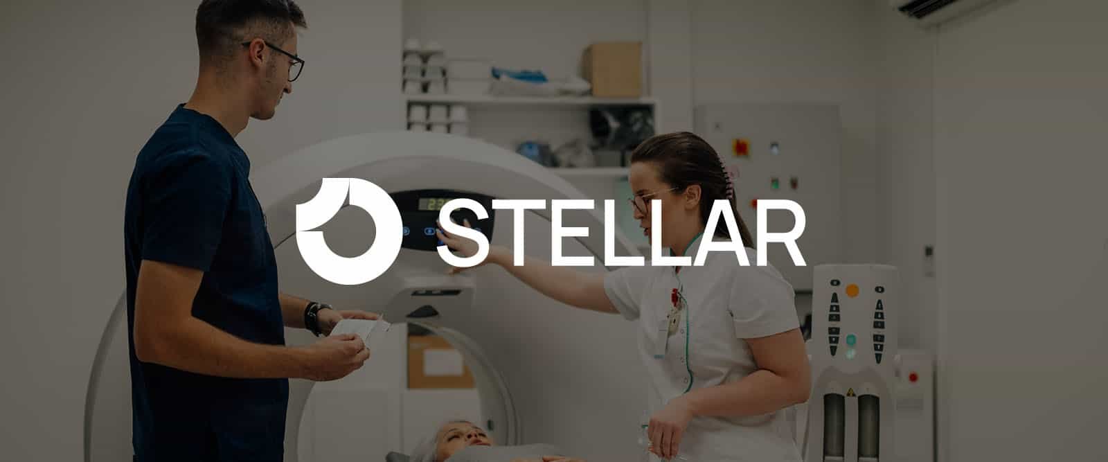 A healthcare worker prepares a patient for a scan in an NYC clinic while another person stands nearby; the word "STELLAR" is displayed over the image.