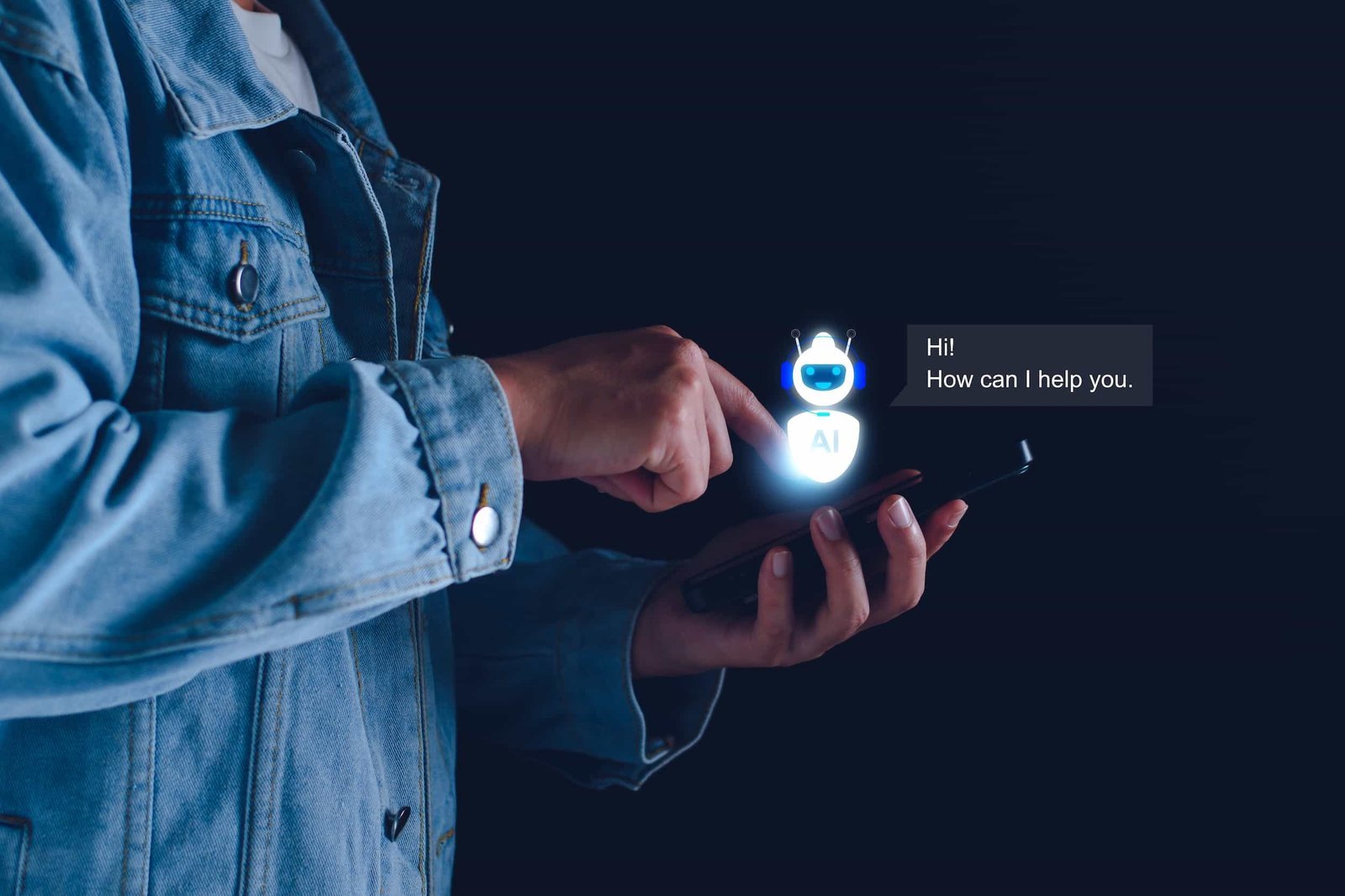 A person in a denim jacket uses a smartphone, interacting with a digital AI chatbot saying, “Hi! How can I help you.” on a dark background. How I’m Preparing WordPress Sites for the AI Search Revolution in NYC web design and SEO.