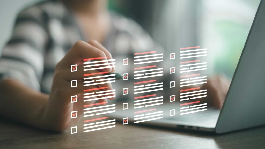 Person using a laptop with digital checklists and checkboxes displayed in the foreground, indicating task completion or progress tracking. 55% of HIPAA settlements hit small practices in 2022