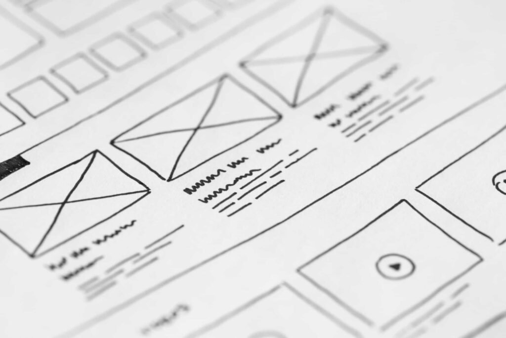 Hand-drawn medical web design wireframe sketch on paper.