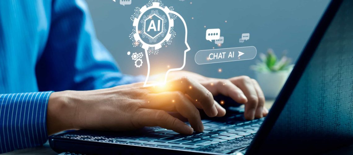how-to-perorm-ai-seo-audit-2025-2026 Person typing on a laptop with digital graphics representing artificial intelligence, chat bubbles, and a head silhouette labeled "AI" appearing above the keyboard.