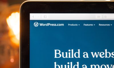 website-maintenance Close-up of a computer screen displaying the WordPress.com website homepage, with the logo and navigation menu at the top—ideal for managing updates and maintenance tasks.
